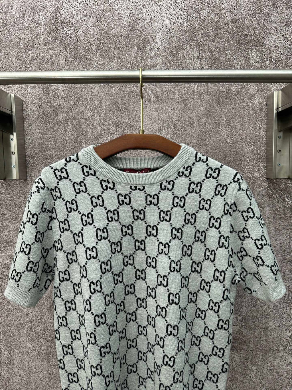 Light gray knit T-shirt with black GG pattern and ribbed crew neckline