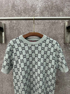 Light gray knit T-shirt with black GG pattern and ribbed crew neckline