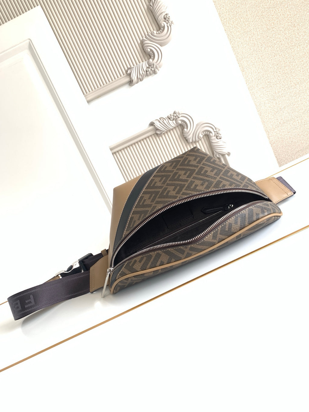 Fendi crossbody bag with FF monogram exterior and zipper opening visible