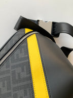 Fendi bag side view with neon yellow trim stripe, textured fabric, and adjustable shoulder strap.