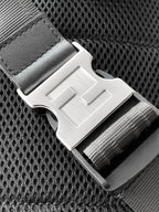 Fendi crossbody bag detail with metal buckle strap and textured dark mesh panel