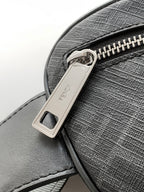 Fendi crossbody bag close-up with silver logo buckle and top zipper track