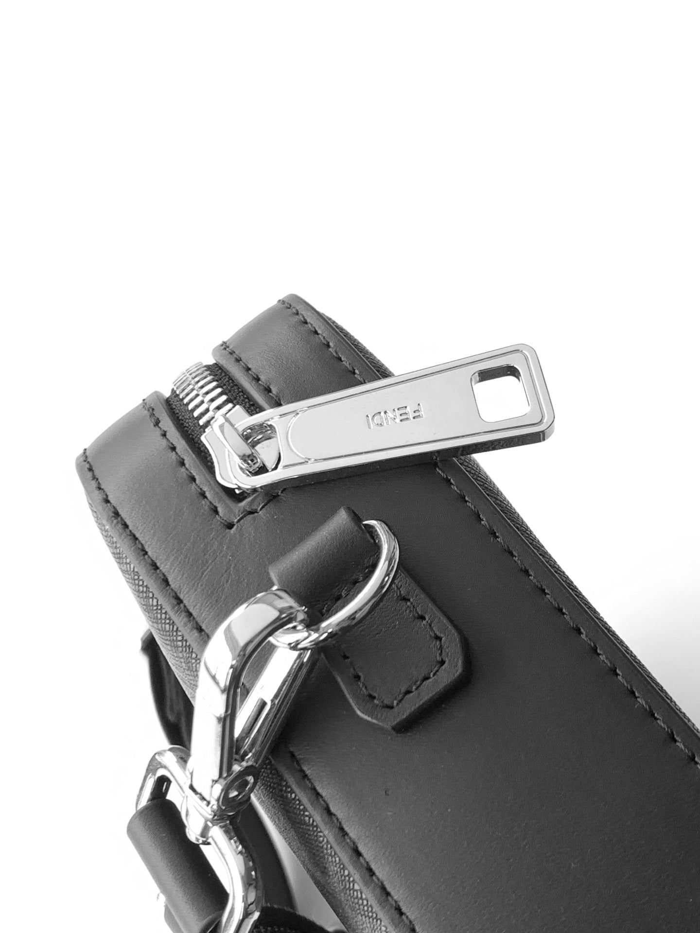 Fendi bag close-up of silver buckle hardware on dark strap