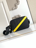 Fendi crossbody bag in dark tones with yellow trim, logo pattern, and adjustable strap