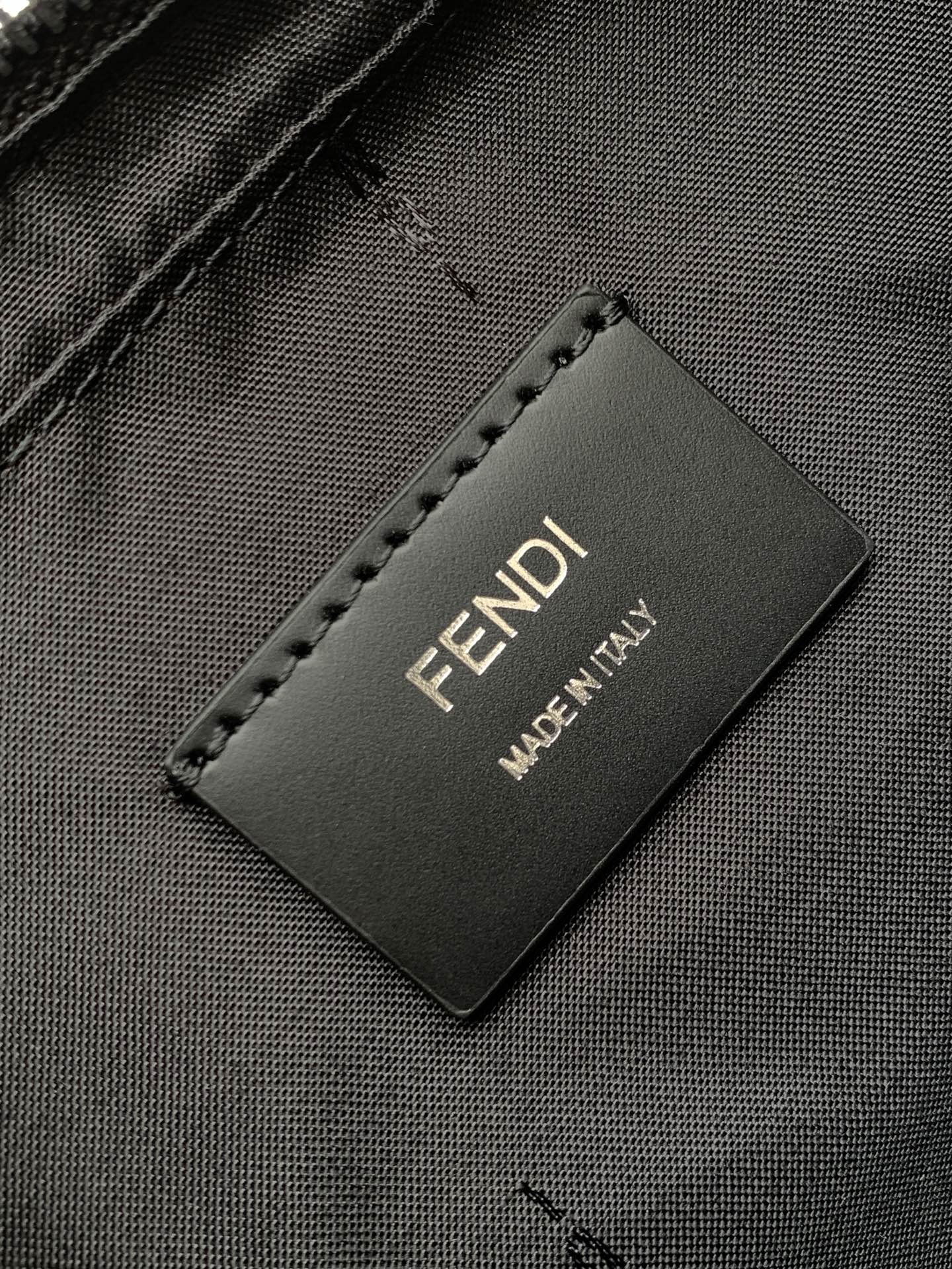 Fendi bag interior label reading "FENDI" and "MADE IN ITALY"