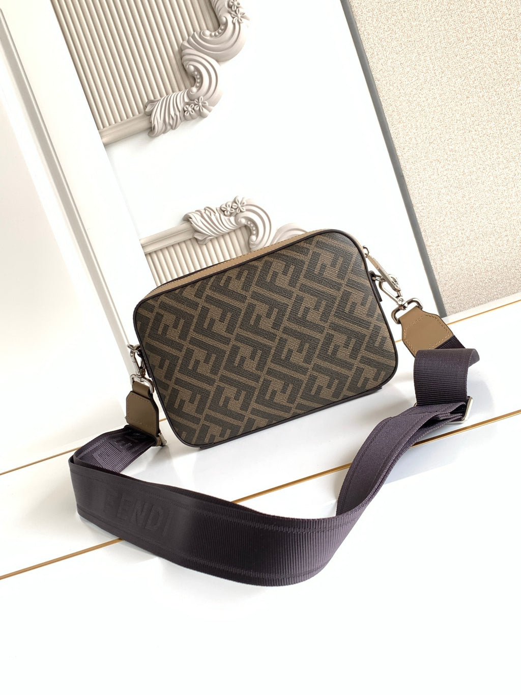 Fendi logo canvas crossbody bag with dark strap and tan front trim
