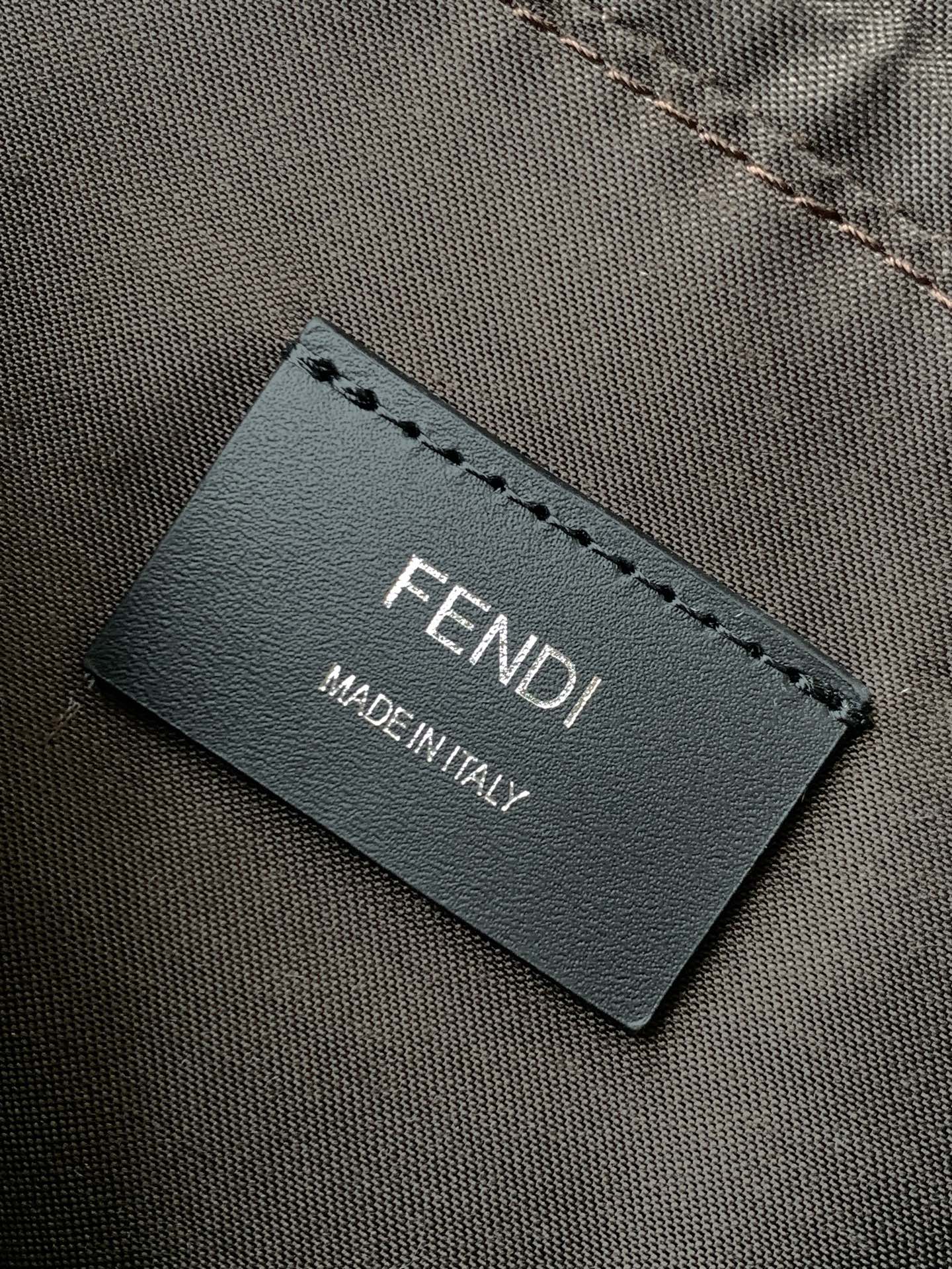 Fendi label on dark bag interior with MADE IN ITALY text