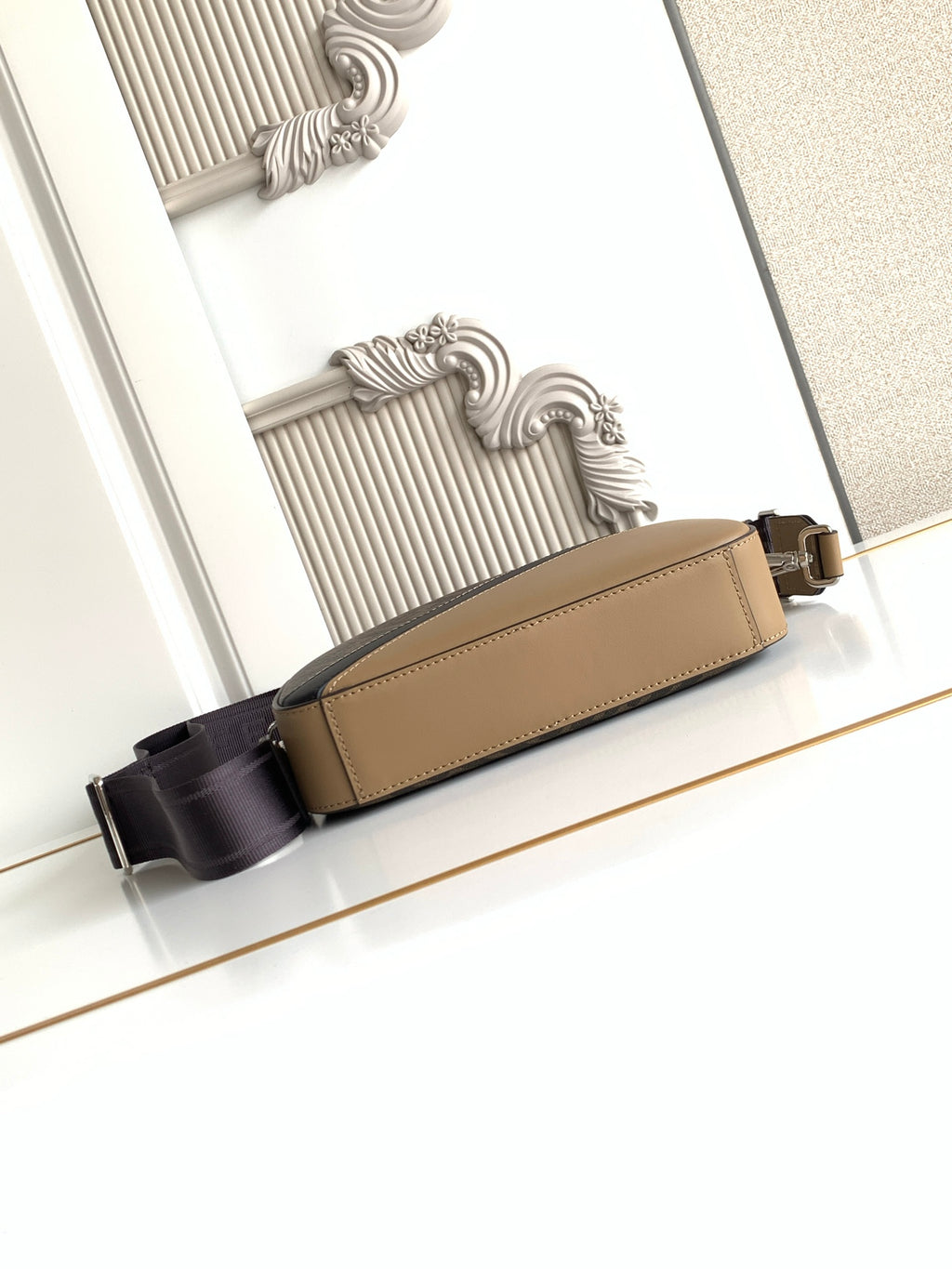 Fendi tan leather crossbody bag with black strap and gold-tone buckle hardware