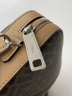 Fendi crossbody bag close-up of tan leather strap and silver clasp hardware