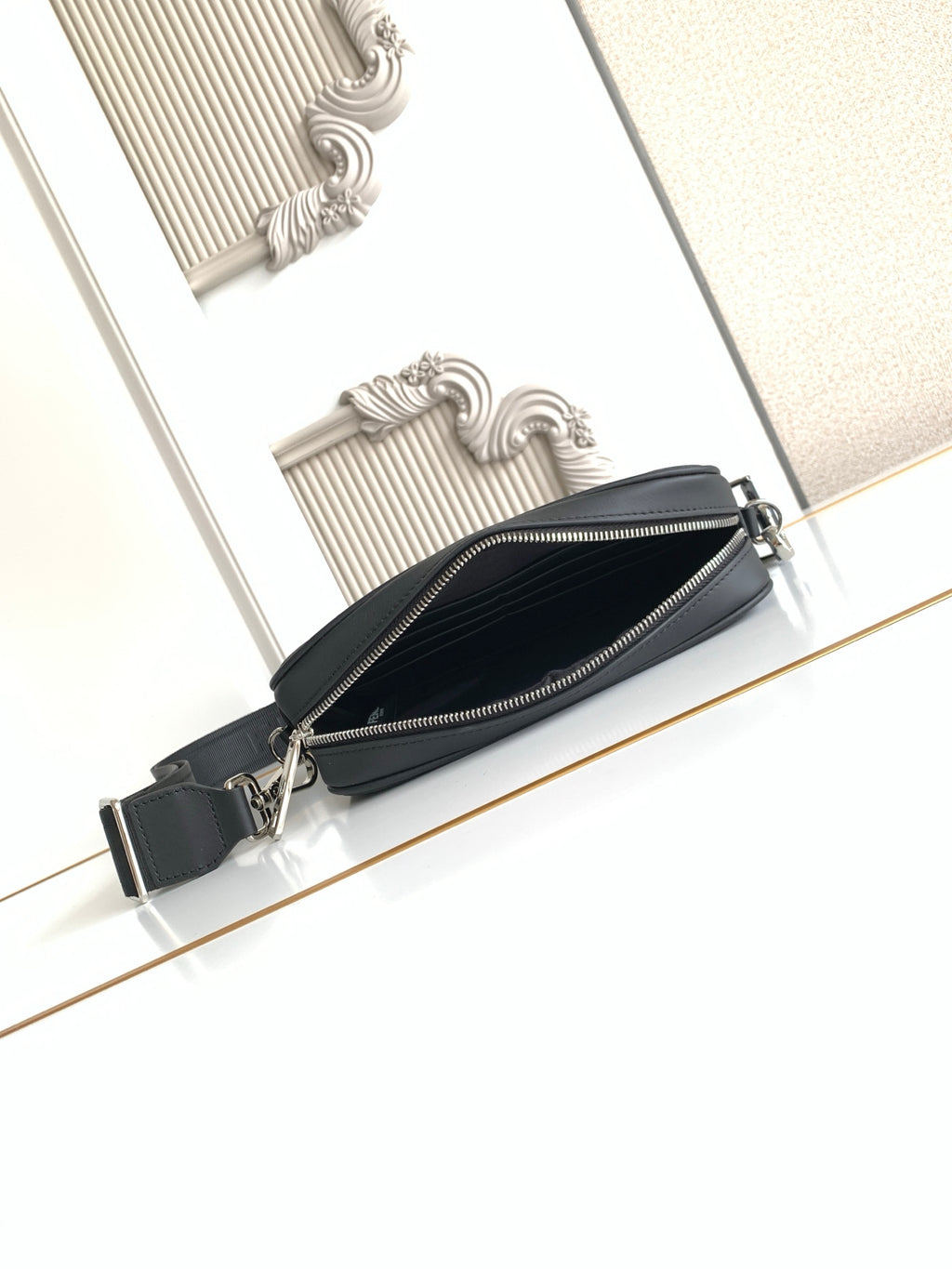 Fendi black zip crossbody bag with adjustable strap and side zipper