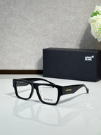 Black full-rim eyeglasses with rectangular frames and clear lenses, Montblanc branding