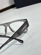 Close-up of black temple arm on eyeglasses with clear lens and Montblanc branding