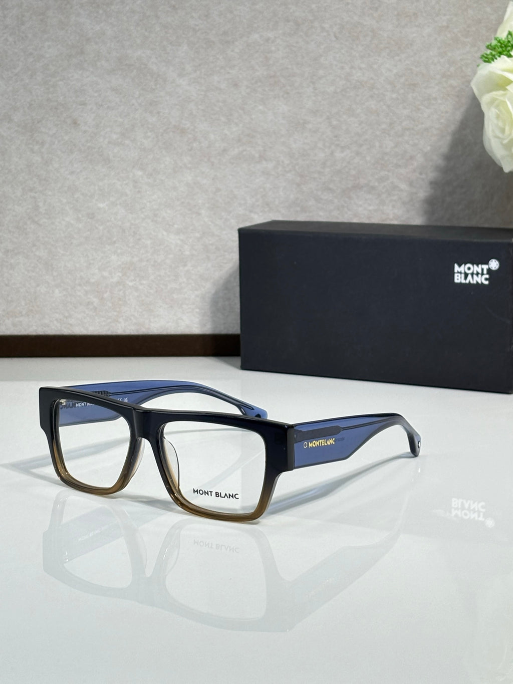 Navy and black full-rim eyeglasses with clear lenses, Montblanc logo on temples