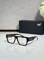 Tortoiseshell temple eyeglasses with black rectangular frames and clear lenses