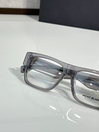 Close-up of gray full-rim eyeglasses showing clear lenses and side hinge