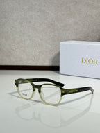 Dior eyeglasses with green full-rim frames and clear lenses, side view
