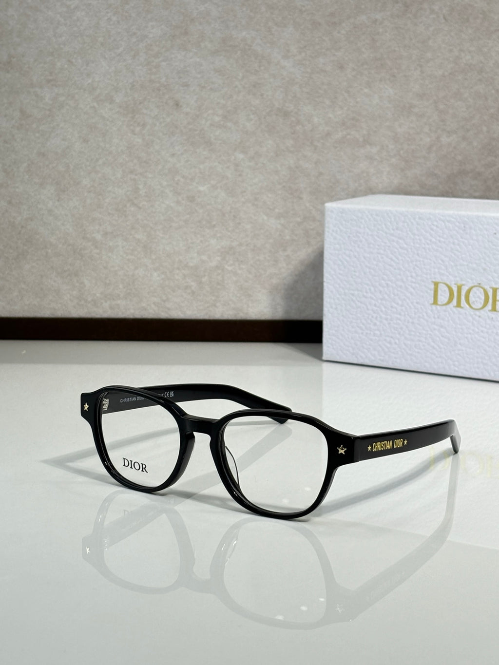 Dior eyeglasses with black full-rim frames and clear lenses, side view