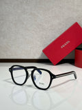 Prada eyeglasses with black round frames and clear lenses, side arms with logo.