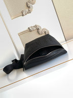 Black Fendi crossbody bag with top zipper and embossed logo on front
