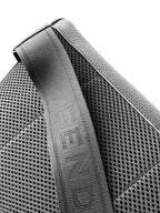Black perforated leather strap panel with textured weave and stitch edging