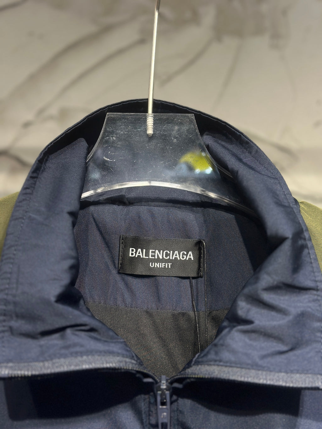 Navy windbreaker with Balenciaga UNIFIT inner label and zipper at neckline