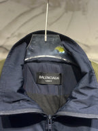Navy windbreaker with Balenciaga UNIFIT inner label and zipper at neckline