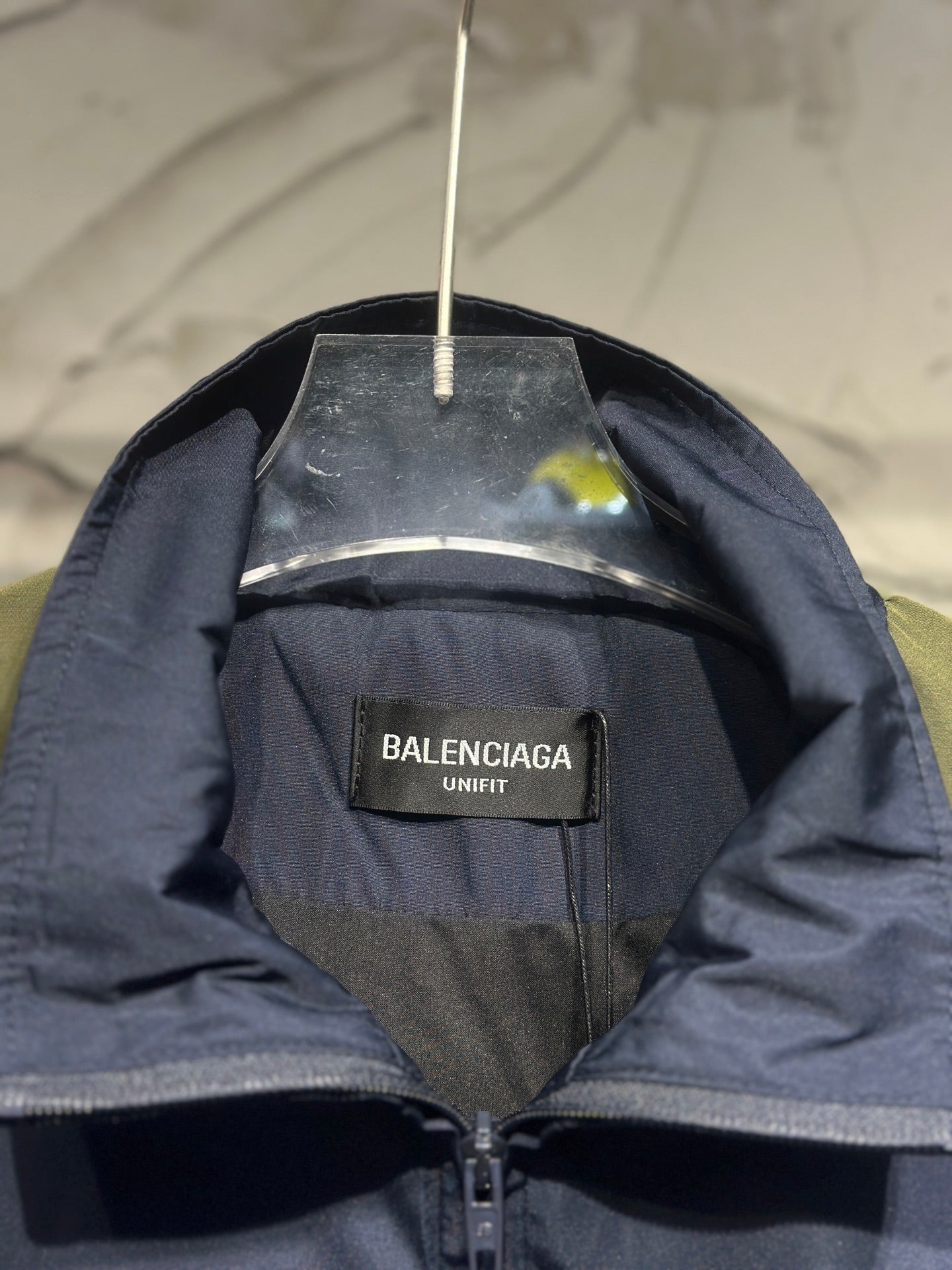 Navy windbreaker with Balenciaga UNIFIT inner label and zipper at neckline