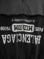Black hoodie back with large white graphic text and vertical zipper line