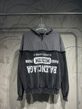 Long-sleeve hoodie with black and white check hood, black body, and large front graphic print