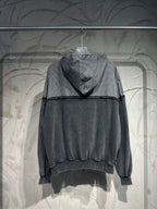 Balenciaga hooded sweatshirt with gray checkered hood and dark body, long sleeves
