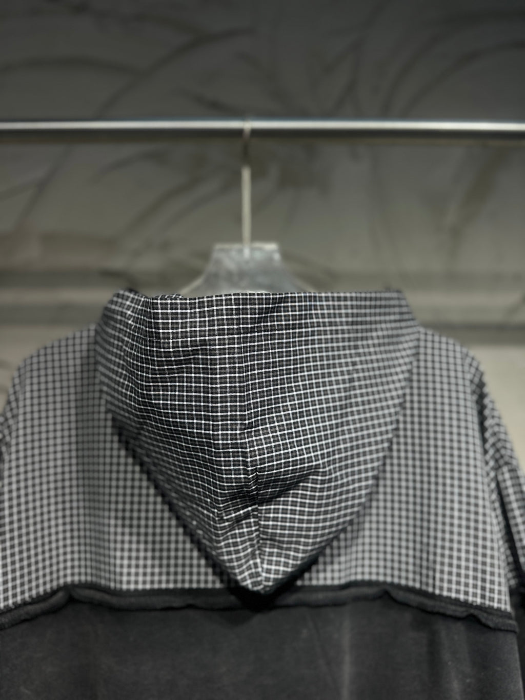 Balenciaga hooded sweatshirt back view with gray checkered hood and dark panel