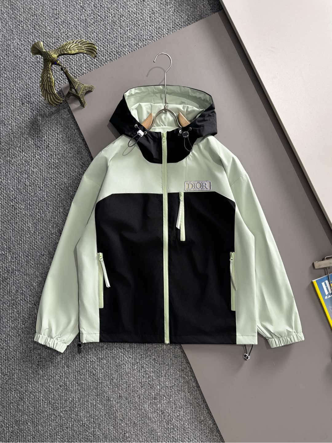 Mint and black long jacket with hood, front zip and drawstring hem
