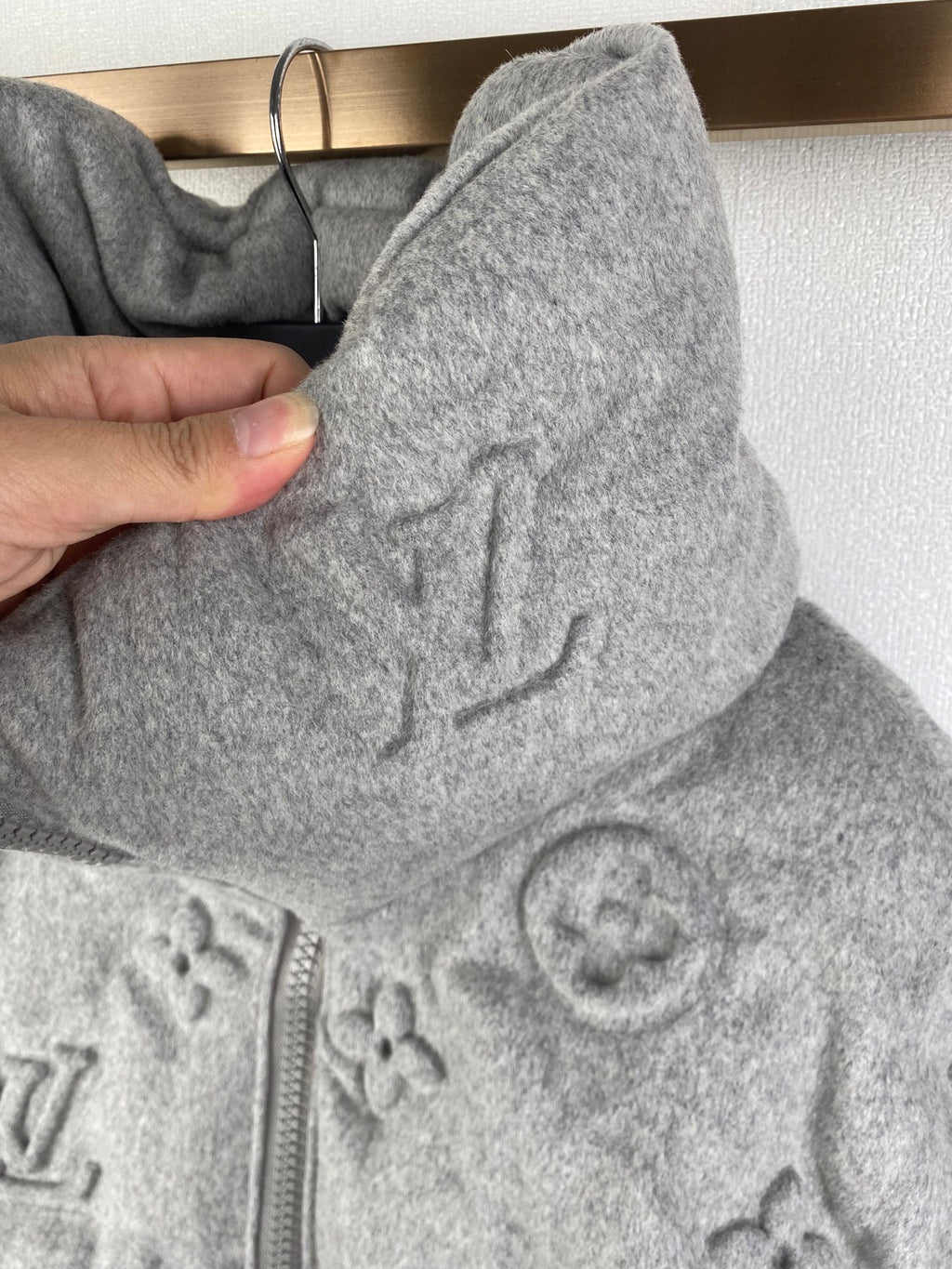 Louis Vuitton hooded jacket side view, gray monogram fabric and drawstring hood