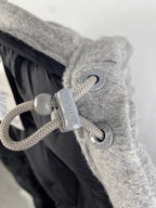 Louis Vuitton hooded jacket drawstring toggle and cord detail on gray fabric