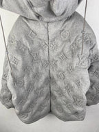 Louis Vuitton hooded puffer jacket front view, gray with allover monogram pattern