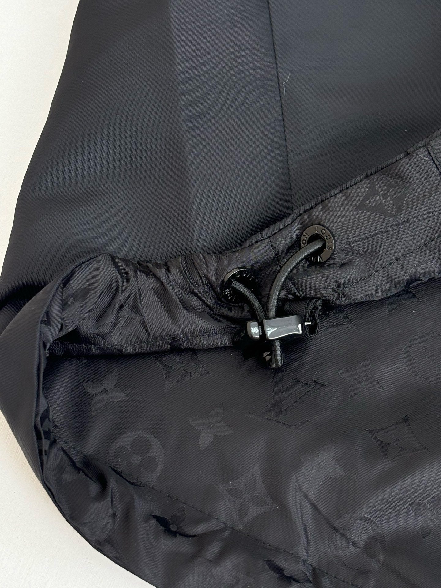 Louis Vuitton long coat, dark fabric hood hem with drawstring and metal clasp
