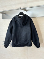 Hooded zip-up jacket in dark navy with stand collar, back view on hanger