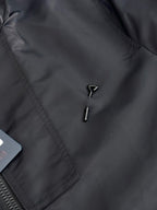 Louis Vuitton long coat front detail with stitched panel and two metal zipper pulls