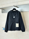 Hooded zip-up jacket in dark navy with stand collar and elastic cuffs, front view