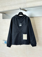 Hooded zip-up jacket in dark navy with stand collar and elastic cuffs, front view