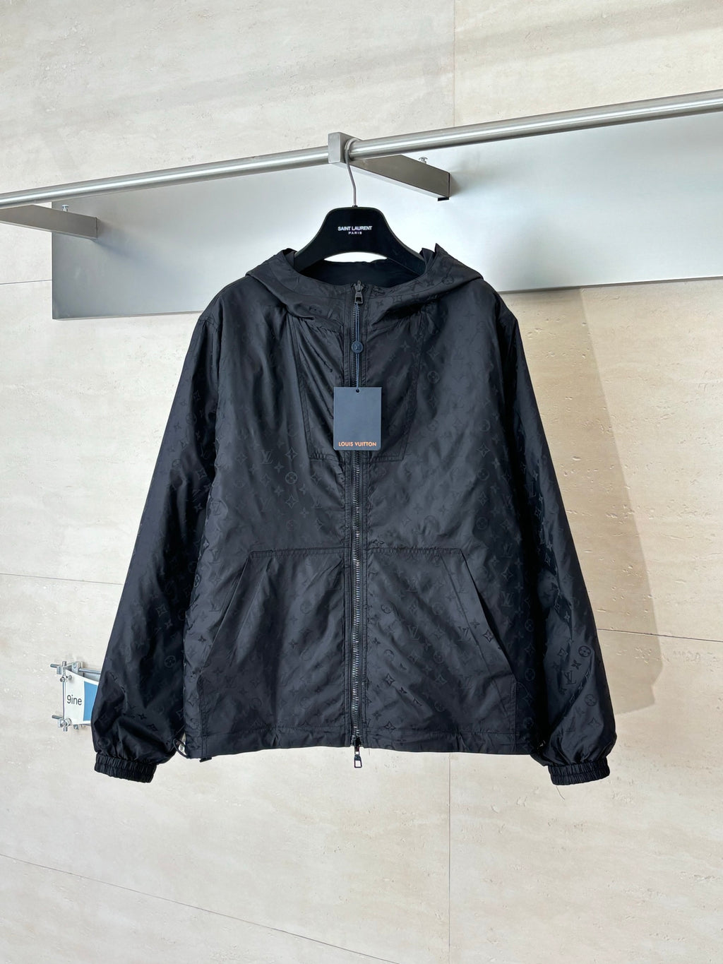 Hooded zip-up jacket in dark navy with front zipper and stand collar, front view