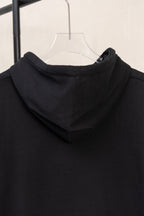 Black pullover hoodie neckline with hood and layered drawstring area