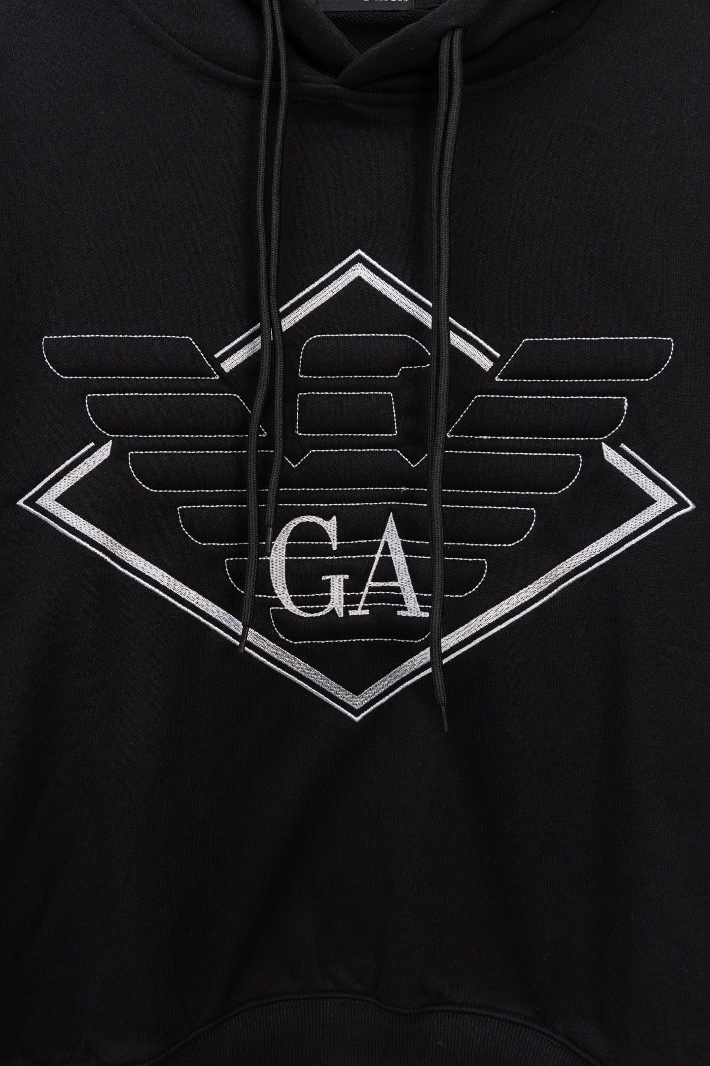 Black pullover hoodie with large center logo print and drawstring cords