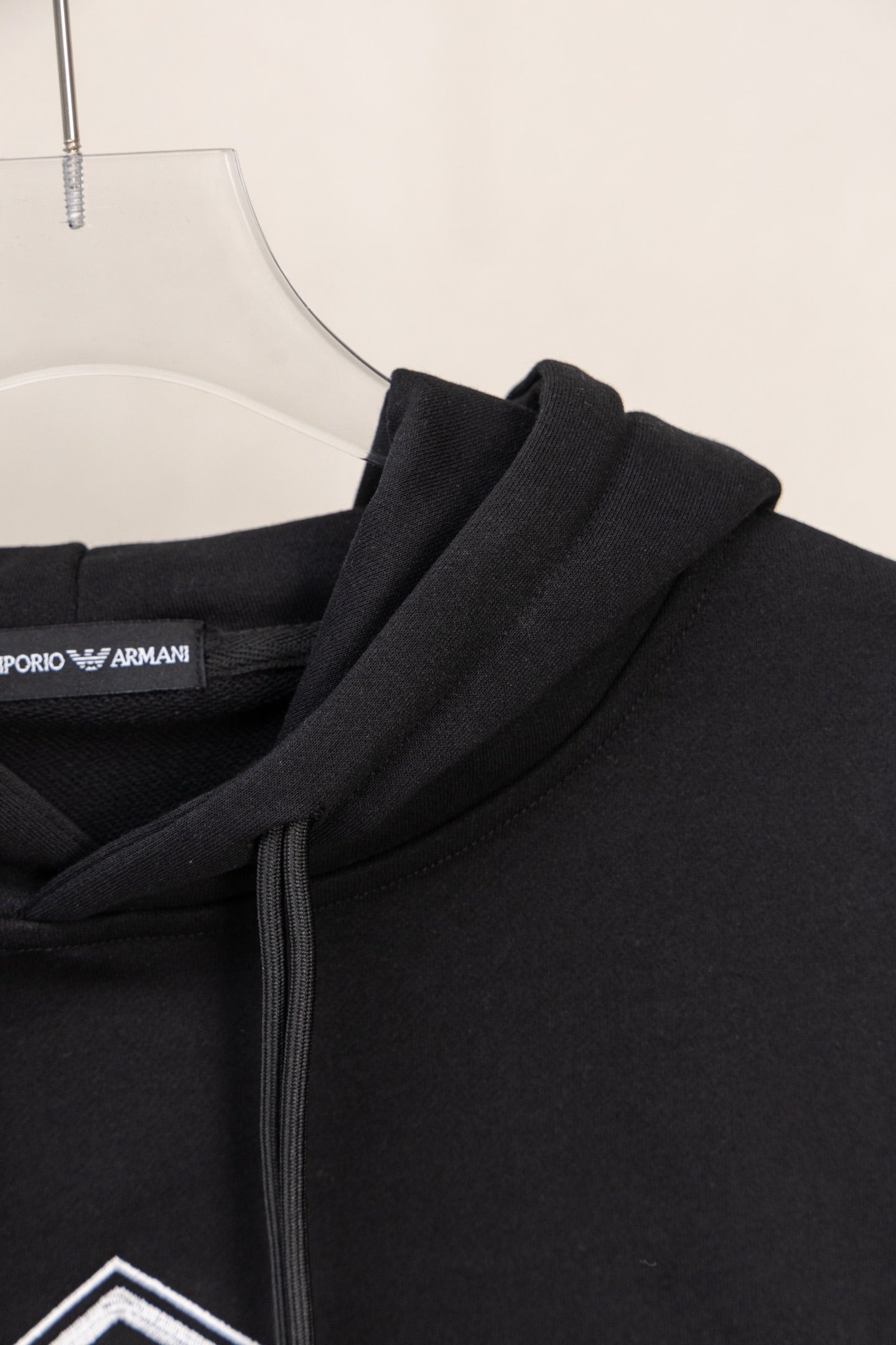 Black hoodie fabric and shoulder seam with inner neck label