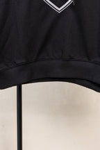 Black hoodie hem with ribbed trim and bottom edge
