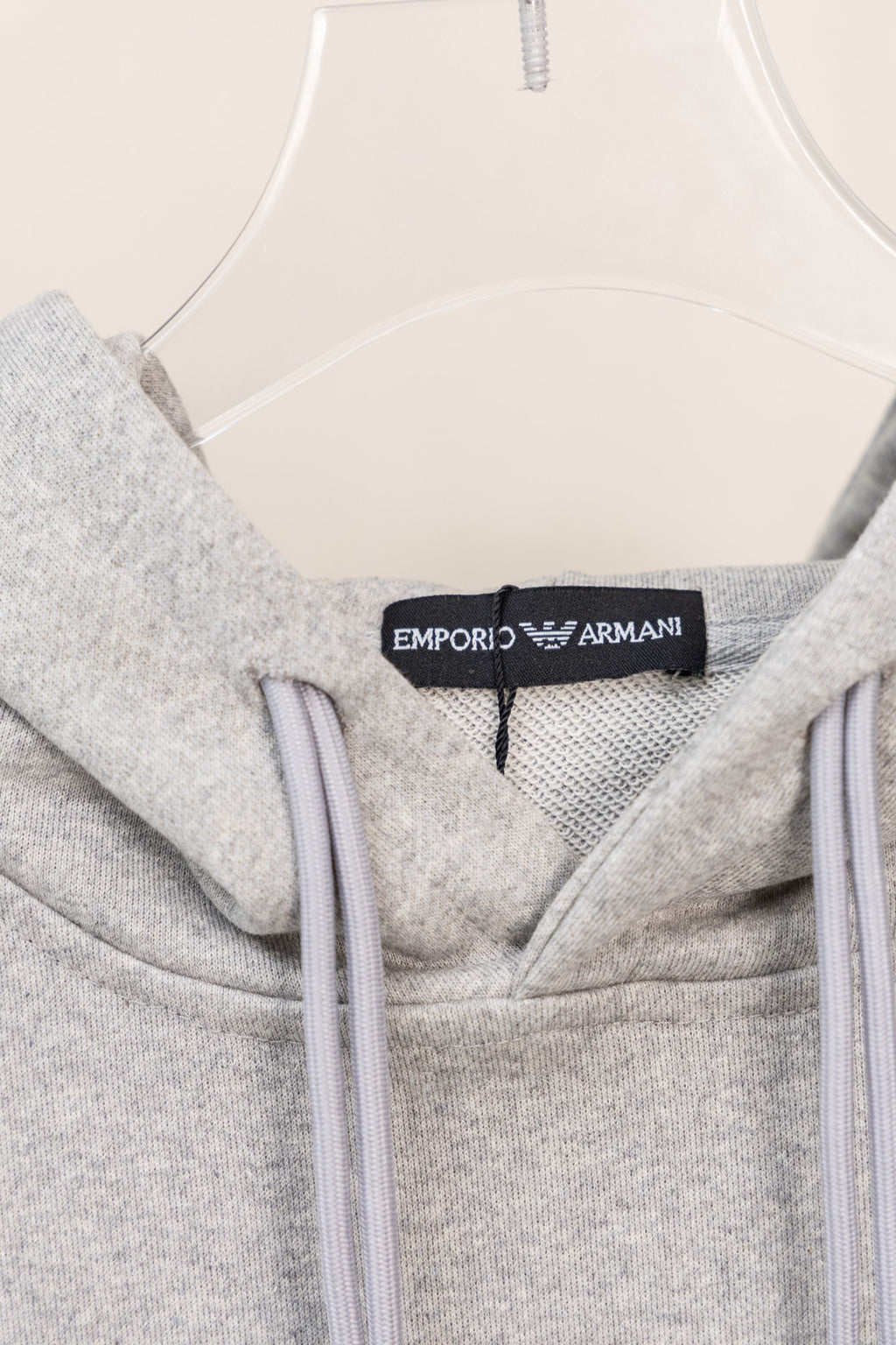 Amiri hoodie neckline detail with hood lining and logo label at collar