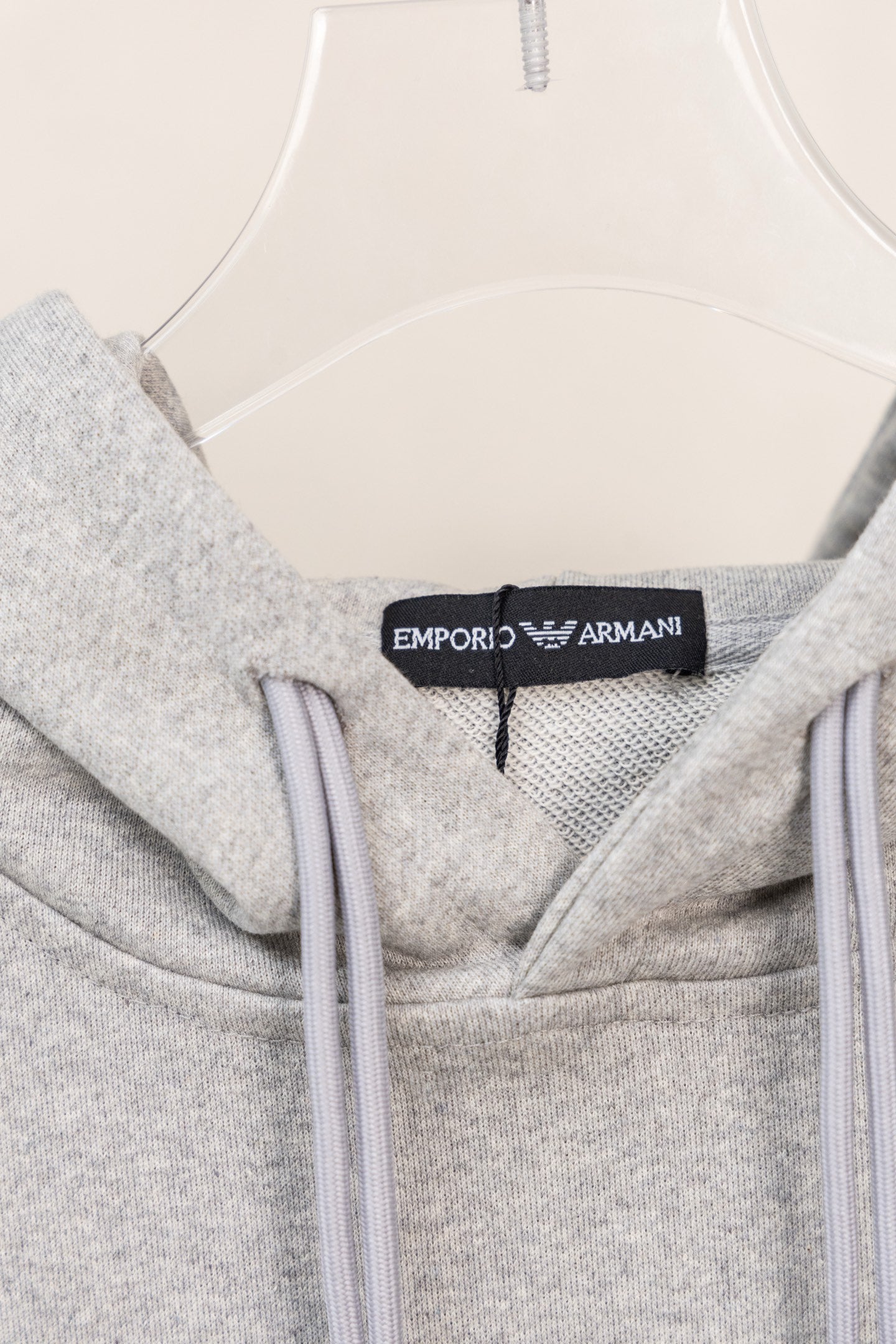 Amiri hoodie neckline detail with hood lining and logo label at collar
