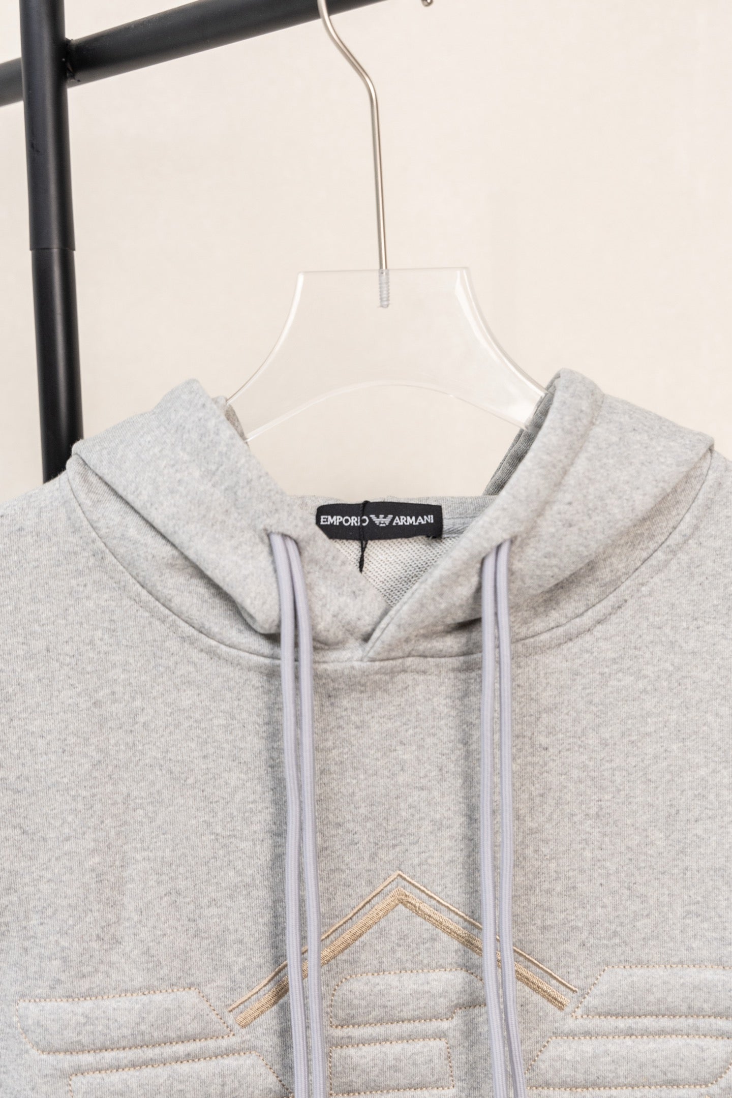 Amiri hoodie in light gray heather with embroidered V-style front design