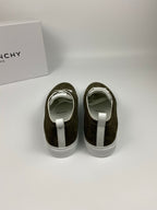 Olive suede sneakers from back view with white heel tabs and white rubber soles.