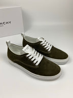Olive suede low-top sneakers with white laces, white midsole, and Givenchy logo details.